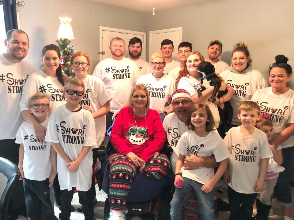 Shari Hall spent her first Christmas after contracting the flu with her family. They wore "Shari Strong" T-shirts to show their support for her.