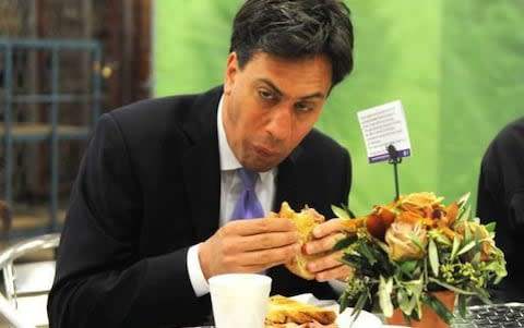 Ed Miliband having trouble eating a bacon sandwich in 2014 - Credit: Eyevine