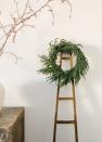 <p>afloral.com</p><p><strong>$68.00</strong></p><p>This Norfolk pine wreath is an artificial option that could fool family and friends with the greenest of thumbs. </p>
