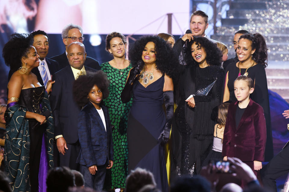 Smokey Robinson (2nd L), Berry Gordy (3rd L), host Tracee Ellis Ross (center R) stand onstage as Rhonda Ross Kendrick (L) presents the Lifetime Achievement award to honoree Diana Ross (center L) 