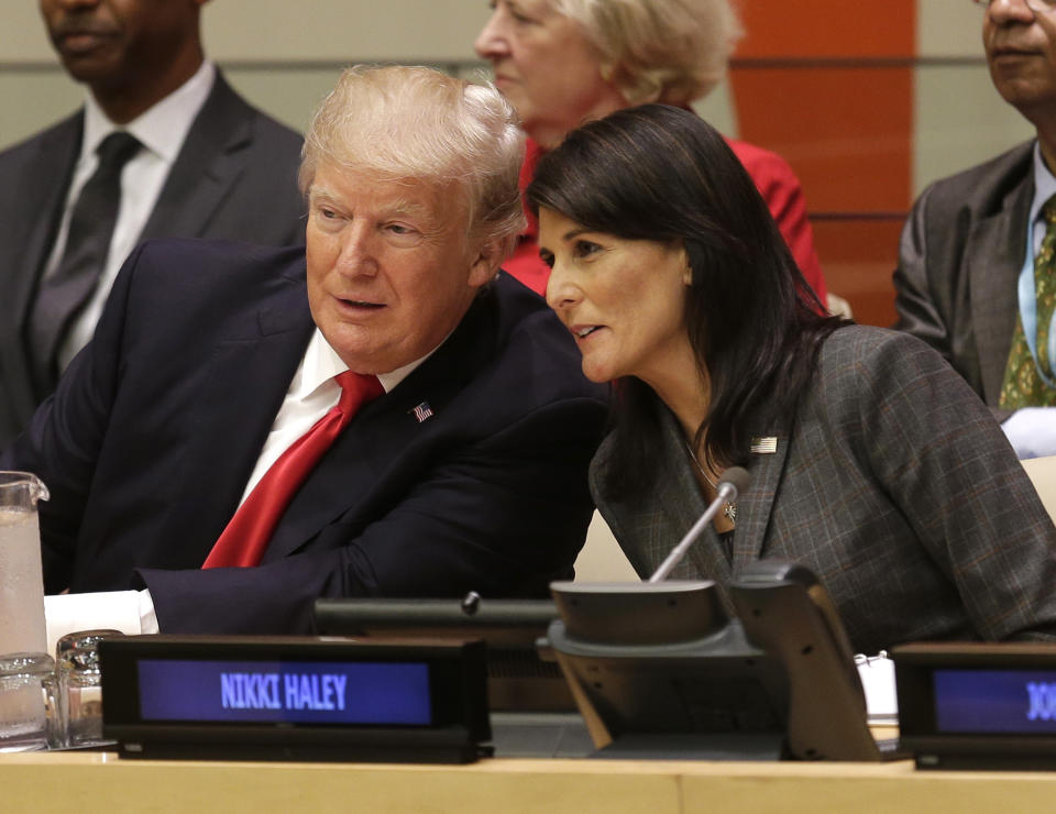 FILE - United States President Donald Trump speaks with U.S. Ambassador to the United Nations Nikki Haley before a meeting during the United Nations General Assembly at U.N. headquarters, Sept. 18, 2017. In early 2016, the then-South Carolina governor said she was “embarrassed” by candidate Donald Trump and decried his reluctance to condemn white supremacists. Nine months later, she agreed to join his Cabinet, serving as a key validator as Trump sought to win over skeptical world leaders and voters at home. (AP Photo/Seth Wenig, File)