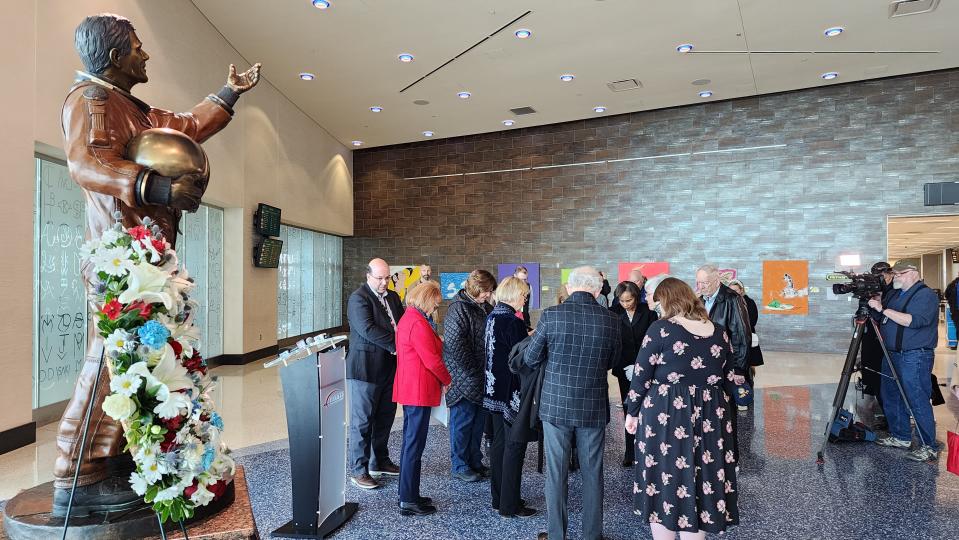 Friends and attendees join in group prayer Wednesday to honor the anniversary of Rick Husband's last flight as commander in the tragic 2003 Columbia Space Shuttle reentry crash, which took his and six other astronauts' lives.