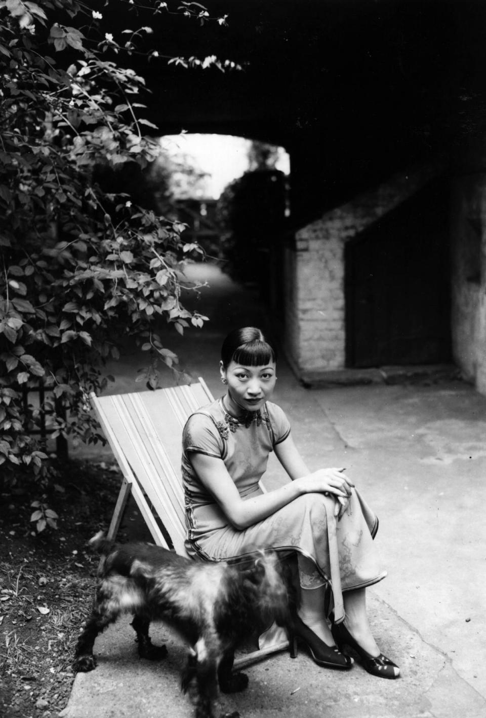 Anna May Wong in the garden with her dog, in 1937 (General Photographic Agency/Getty Images)