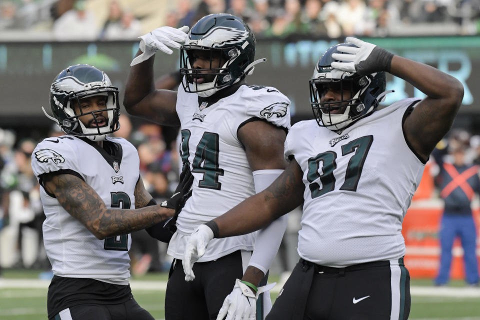 Philadelphia Eagles defensive end Josh Sweat (94) celebrates after sacking New York Jets quarterback Zach Wilson during the first half of an NFL football game, Sunday, Dec. 5, 2021, in East Rutherford, N.J. (AP Photo/Bill Kostroun)