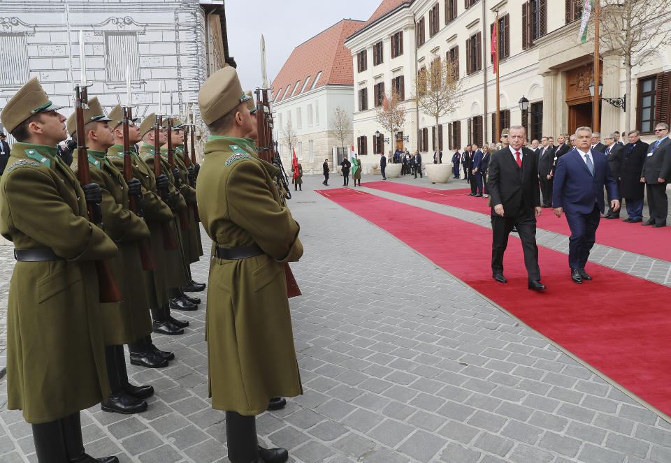 Hungarian Prime Minister Viktor Orban, right, and Turkish President Recep Tayyip Erdogan inspect a military honour guard, in Budapest, Hungary, Thursday, Nov. 7, 2019. Erdogan is on a one-day state visit to Hungary. (Presidential Press Service via AP, Pool)