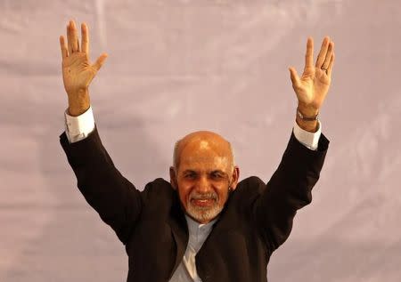 Afghan president-elect Ashraf Ghani Ahmadzai waves as he participates an event in Kabul September 22, 2014. REUTERS/Omar Sobhani