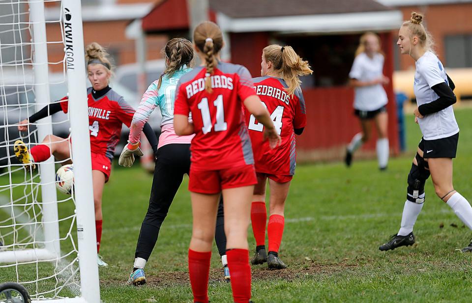 Loudonville High School's Addison Lowe (14) saves a shot taken by Northwestern High School before it gets into the net during high school girls soccer action in Loudonville Thursday, Sept. 29, 2022. TOM E. PUSKAR/ASHLAND TIMES-GAZETTE