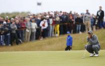 Tiger Woods of the U.S. lines up his putt on the fifth green during the first round of the British Open golf championship on the Old Course in St. Andrews, Scotland, July 16, 2015. REUTERS/Paul Childs