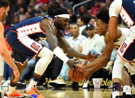 Mar 30, 2019; Los Angeles, CA, USA; Los Angeles Clippers forward Montrezl Harrell (left) and Cleveland Cavaliers guard Collin Sexton (right) battle for a loose ball in the first half at Staples Center. Mandatory Credit: Jayne Kamin-Oncea-USA TODAY Sports