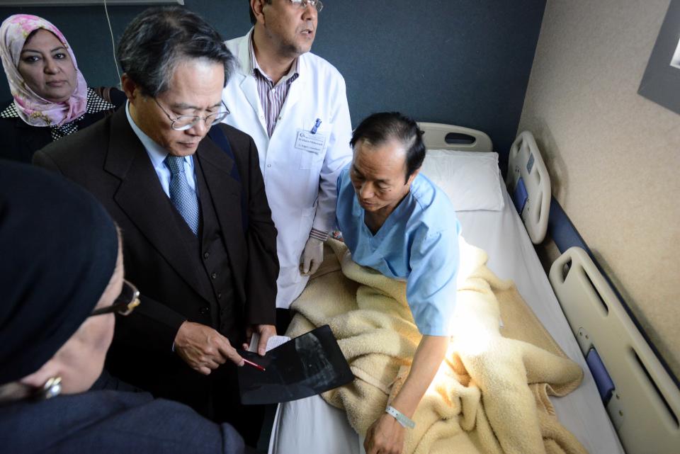 Deputy Chief of Mission of the South Korean Embassy in Egypt, Mr. Kwon Sae Young, looks at an x-ray of a man who was wounded in a deadly explosion Sunday near the Egyptian border crossing with Israel at Taba, at a hospital in Sharm el Sheikh, Egypt, Monday, Feb. 17, 2014. An explosion tore through a bus filled with South Korean sightseers in the Sinai Peninsula on Sunday, killing at least four people and raising fears that Islamic militants have renewed a bloody campaign to wreck Egypt’s tourism industry. (AP Photo)