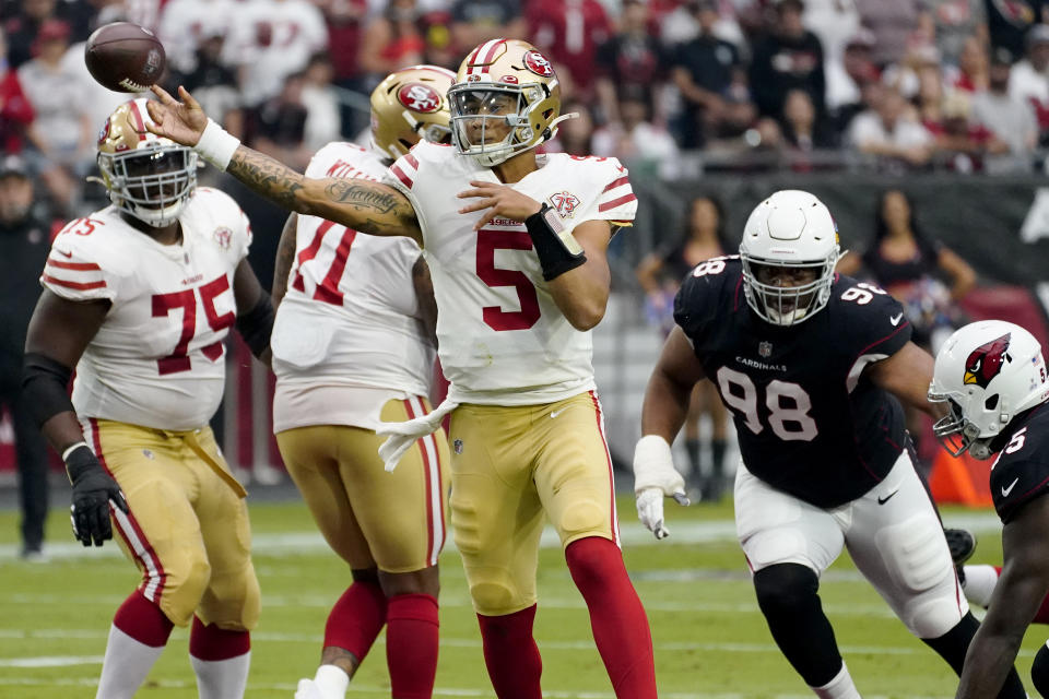 San Francisco 49ers quarterback Trey Lance (5) throws against the Arizona Cardinals during the first half of an NFL football game, Sunday, Oct. 10, 2021, in Glendale, Ariz. (AP Photo/Matt York)