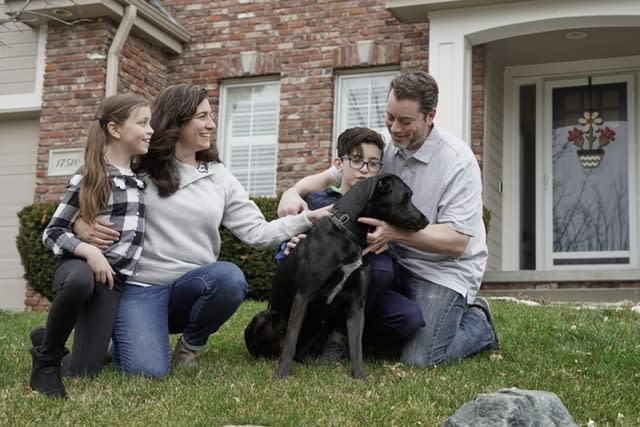 Kim Simeon, her husband, Adam and children, Annabel, nine, and Brennan, 11, with Nala, a dog they are fostering, in Omaha, Nebraska