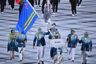 <p>Aruba's delegation brought bright colors to the opening ceremony, donning green and teal ensembles and matching hats. </p>