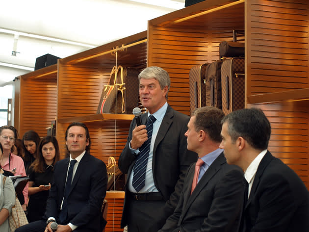 Yves Carcelle, chairman and CEO of Louis Vuitton Malletier, addresses the press on Saturday, at a conference packed with international journalists. (Yahoo! photo)