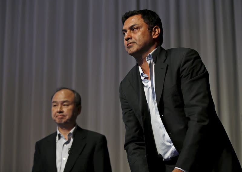 SoftBank Corp. Chief Executive Masayoshi Son (L) and Nikesh Arora, former Google chief business officer and currently SoftBank Vice Chairman, leave a news conference in Tokyo May 11, 2015. REUTERS/Issei Kato