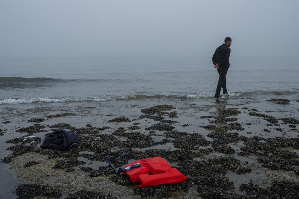 A Kurdish migrant who failed in his attempt to reach the United Kingdom by boat walks back to the town of Ambleteuse, in northern France, on Sunday, May 19, 2024 after being discovered by the police. (AP Photo/Bernat Armangue)