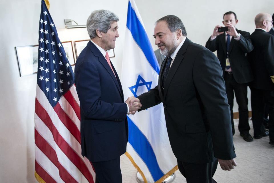 Israeli Foreign Minister Avigdor Lieberman, right, shakes hands with U.S. Secretary of State John Kerry, ahead of their meeting at the David Citadel hotel in Jerusalem, Friday, Jan. 3, 2013. (AP Photo/Brendan Smialowski, Pool)