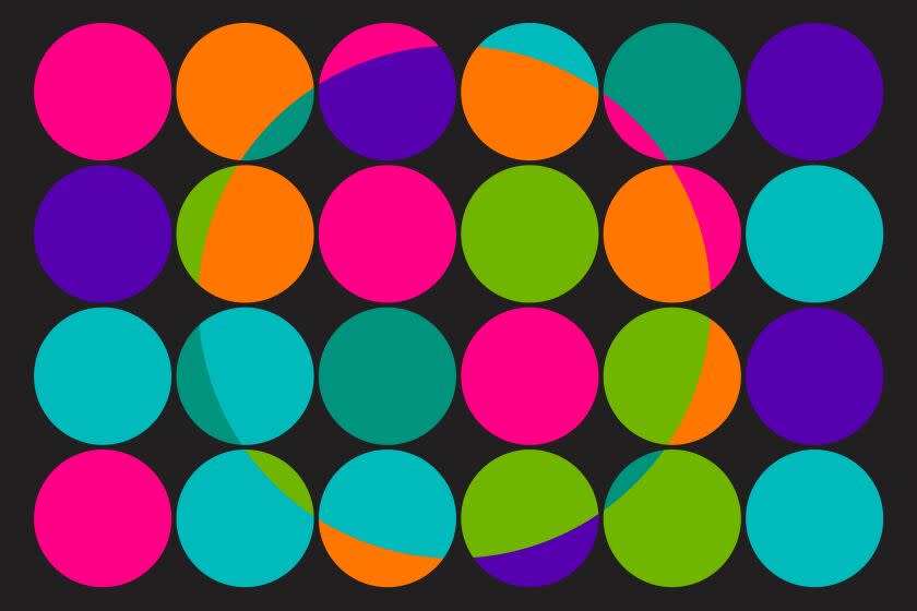 A grid of multi colored circles with a ring in the center where the colors change.