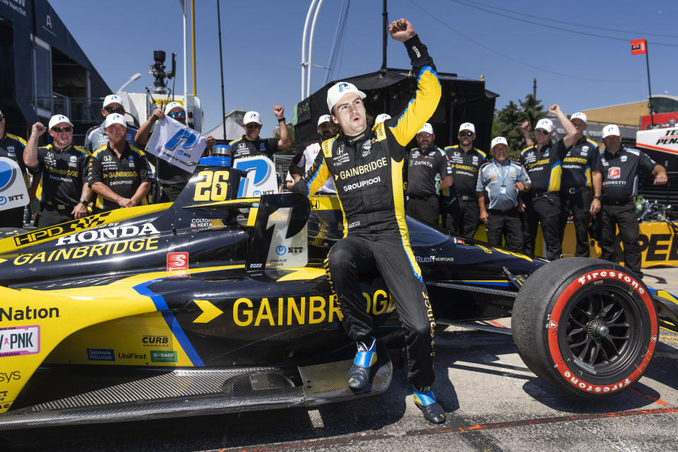 Colton Herta of the United States celebrates winning the pole position following qualifying at the 2022 IndyCar Toronto, in Toronto, Saturday, July 16, 2022. (Mark Blinch/The Canadian Press via AP)