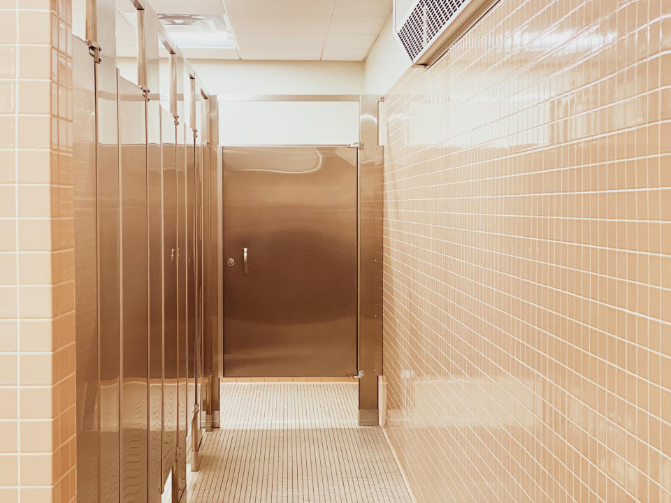 Gaps above and below a bathroom stall