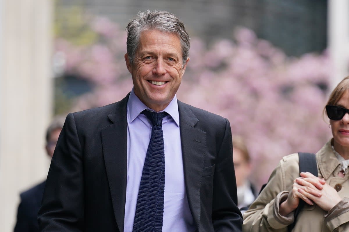 Hugh Grant arrives at the High Court on Thursday (PA)