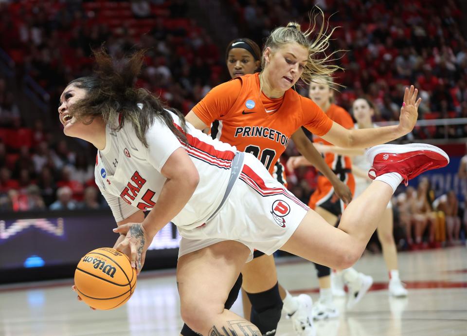 Utah Utes forward Alissa Pili drives and is fouled by Princeton Tigers forward Ellie Mitchell