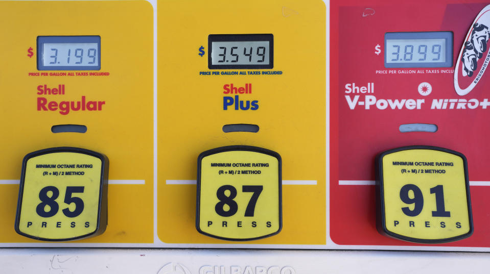 The per-gallon prices of the various grades of gasoline are illuminated on a pump at a Shell station Friday, Nov. 17, 2023, in Englewood, Colo. (AP Photo/David Zalubowski)