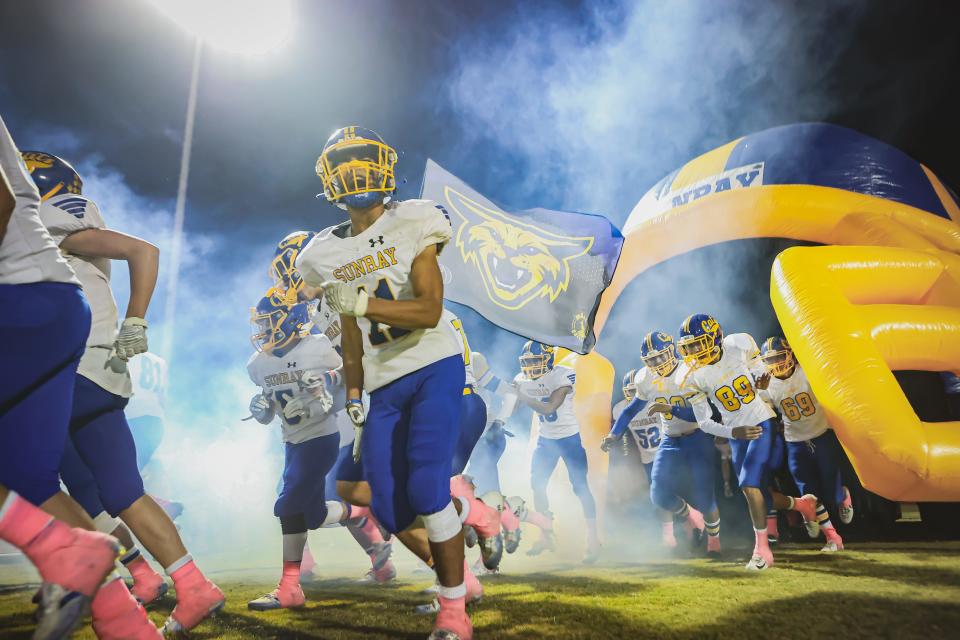 The Sunray football team enters the field before a District 3-2A Division II game Friday, Oct. 29, 2021 against Gruver at Greyhound Stadium in Gruver, Texas.