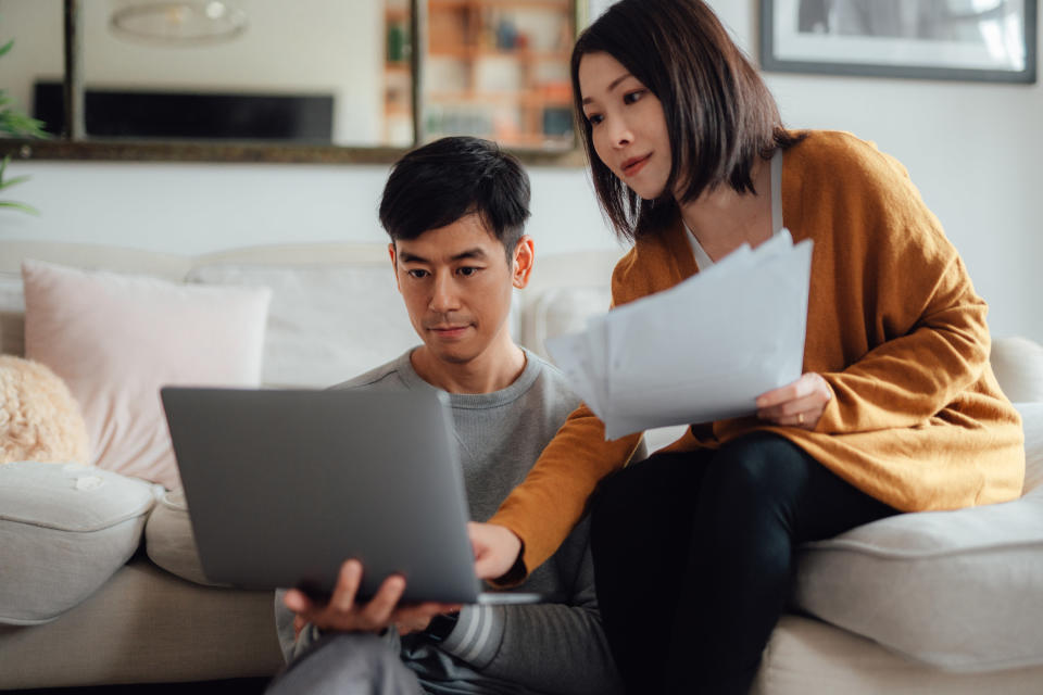 Couple going over financial paperwork together