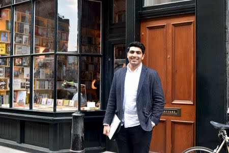 British-Iranian Ali Tehrani, a 24-year-old University College of London graduate and founder of start-up firm KeyPursuit, poses for a photograph in Brick Lane in London, Britain, in this picture taken March 22, 2016. REUTERS/Pamela Barbaglia