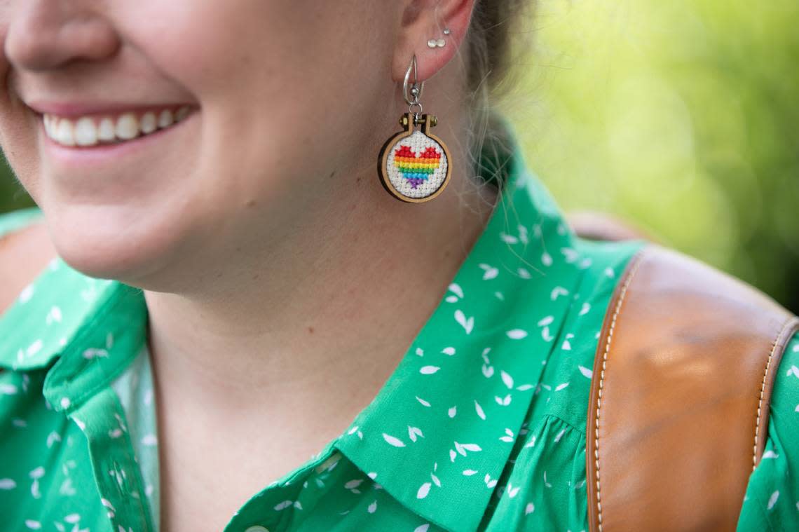 A demonstrator wears rainbow earrings as advocates for LGBTQ+ equality gathered in front of the North Carolina General Assembly on Tuesday, June 27, 2023 to rally in opposition to anti-LGBTQ+ bills moving through the General Assembly. The legislative package includes HB808, a bill which would prohibit access to gender-affirming care for transgender youth in North Carolina as of August 1.