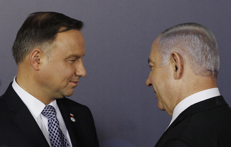 FILE - In this Wednesday, Feb. 13, 2019 file photo, Polish President Andrzej Duda , left, and Israeli Prime Minister Benjamin Netanyahu, talk after a group photo during a two-day international conference on the Middle East, at the Royal Castle in Warsaw, Poland. An off-hand comment by Netanyahu in Warsaw about Poland and the Holocaust looks to overshadow a summit of central European leaders this week in Israel. Poland’s abrupt decision Sunday to downgrade its participation in the Visegrad conference suddenly cast a pall gathering. (AP Photo/Czarek Sokolowski, File)