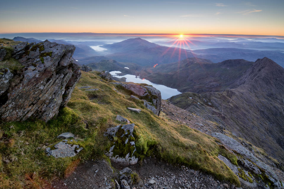 An amazing sunrise over the Snowdonia national park as view from the summit of Snowdon on a cold Octobers morning. 