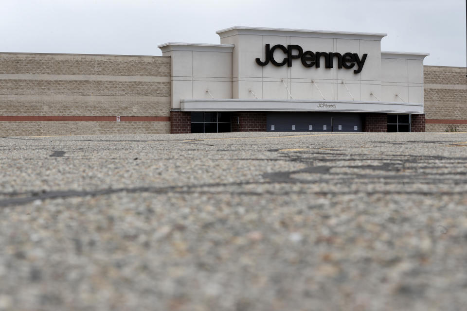 An empty parking lot is shown at a closed JCPenney store in Roseville, Mich., Friday, May 8, 2020. Across the country, in industries of every kind and size, the coronavirus COVID-19 pandemic has devastated businesses small and large. (AP Photo/Paul Sancya)