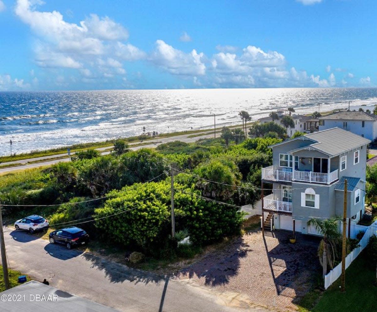 Sitting 200 feet from the beach and a couple blocks from downtown Flagler Beach restaurants and shops, this ocean-view home is three levels of fun and luxurious living that can been accessed by an elevator.