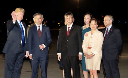 U.S. President Donald Trump is met by Singapore's Foreign Minister Vivian Balakrishnan and other officials after arriving in Singapore June 10, 2018. Ministry of Communications and Information, Singapore/Handout via REUTERS