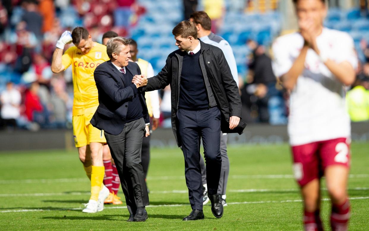 Steven Gerrard (right) shakes hands with Aston Villa chief executive Christian Purslow (left) - GETTY IMAGES