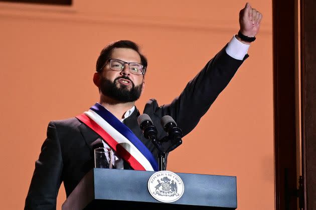 Chile's new president, Gabriel Boric, greets his supporters after delivering a speech at La Moneda Palace in Santiago on March 11, 2022.