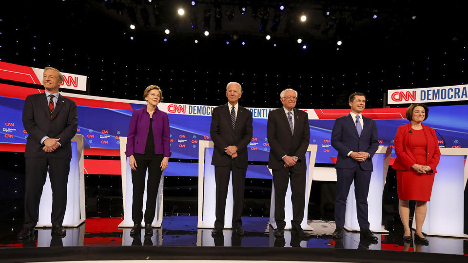 Democratic presidential candidates, stand on stage ahead of Tuesday's debate in Des Moines. (Daniel Acker/Bloomberg via Getty Images)