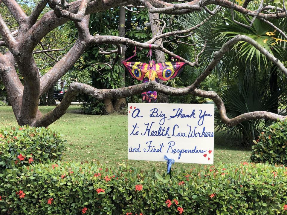 Lila Young posted this sign in her yard on Washington Road in West Palm Beach, Fla. She hosts a nightly hand-clapping tribute in her Prospect Park neighborhood to honor first responders.