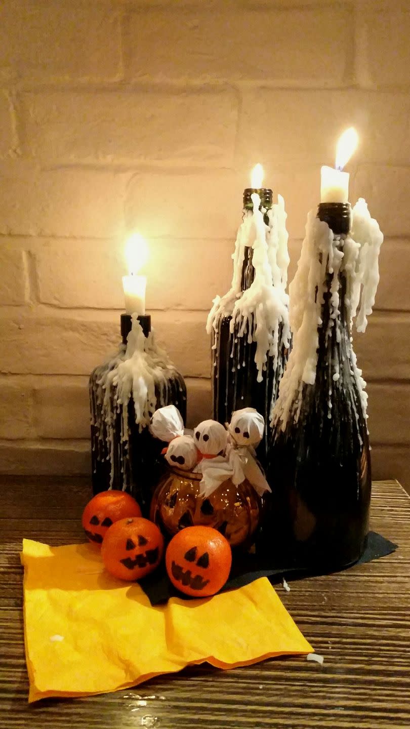 30) Make Dripped Wax Wine Bottles