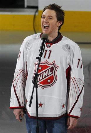 Performer Clay Aiken sings the U.S. anthem before the NHL All-Star hockey game in Raleigh, North Carolina, January 30, 2011. REUTERS/Shaun Best