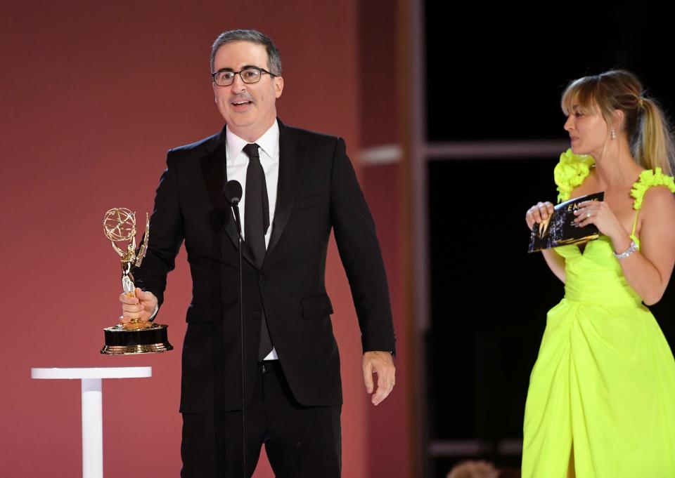 John Oliver accepts the award for outstanding variety talk series for "Last Week Tonight with John Oliver."