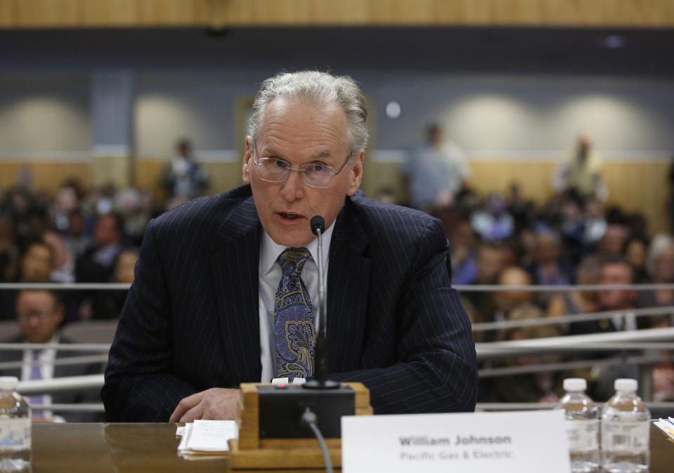 FILE - In this Nov. 18, 2019, file photo, Pacific Gas & Electric CEO Bill Johnson, speaks during an oversight hearing of the Energy, Utilities and Communications committee at the Capitol in Sacramento, Calif. The nation's largest utility limped into bankruptcy vilified for its long-running neglect of a crumbling electrical grid that ignited horrific Northern California wildfires that left entire cities in ruins. It’s unclear if PG&E is now any better equipped to protect the 16 million people who rely on it for power, even after nearly a year-and-a-half in bankruptcy court. In one of its biggest concessions, the company will replace 11 of its board 14 members, including Johnson, who signed a three-year contract 13 months ago. (AP Photo/Rich Pedroncelli, File)