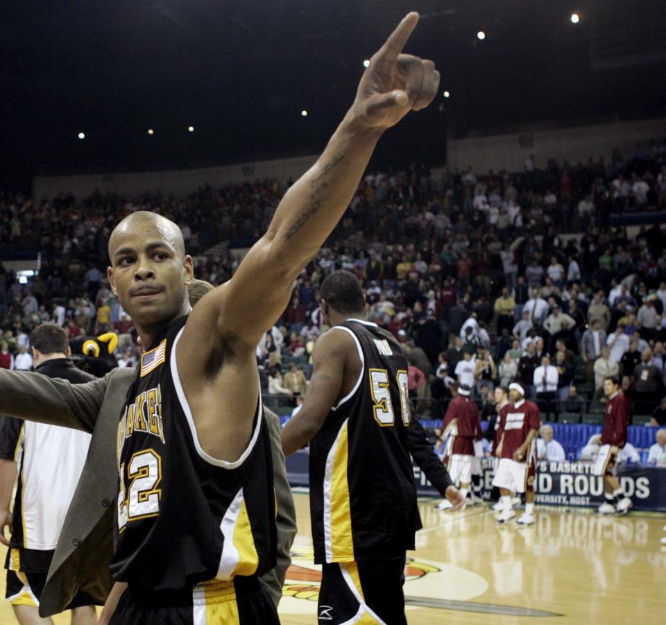 Ed McCants points to the UWM fans at the end of their upset victory at Cleveland State University Wolstein Center, Thursday, March, 17, 2005. UWM beat Alabama in the first round of the NCAA tournament.