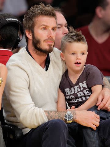 <p>Noel Vasquez/Getty </p> David Beckham with his son Romeo James Beckham at the Los Angeles Lakers versus Dallas Mavericks game in October 2009 in Los Angeles, California.