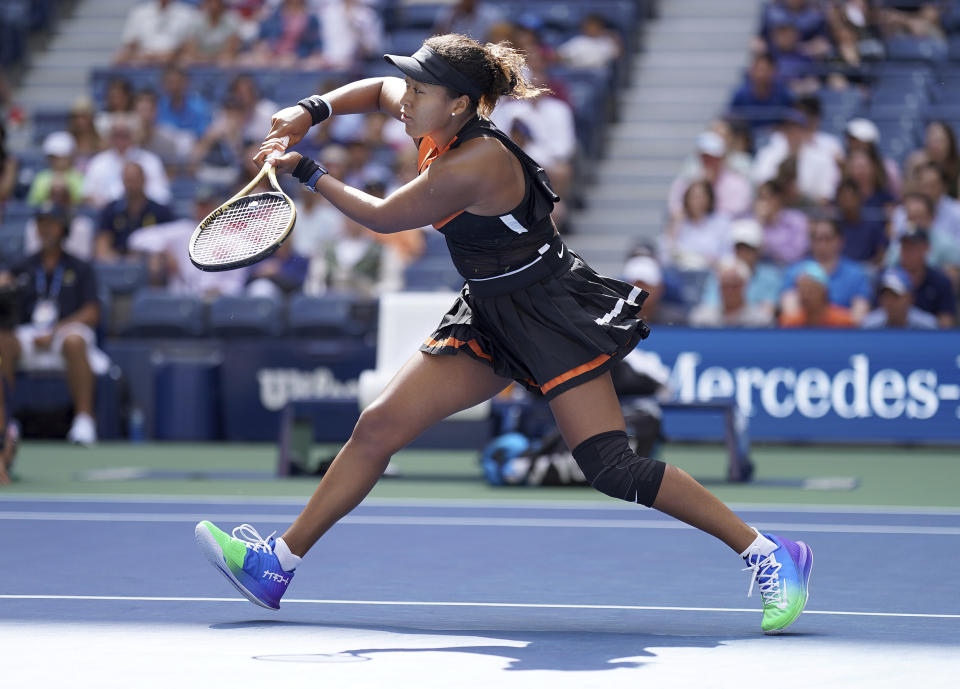 Naomi Osaka, of Japan, returns a shot to Anna Blinkova, of Russia, during the first round of the US Open tennis tournament Tuesday, Aug. 27, 2019, in New York. (AP Photo/Michael Owens)