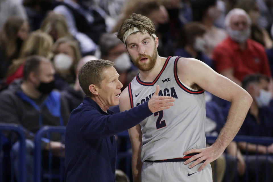 FILE - Gonzaga head coach Mark Few, left, speaks with forward Drew Timme (2) during the first half of an NCAA college basketball game against Loyola Marymount, Thursday, Jan. 27, 2022, in Spokane, Wash. Few believes Timme’s persona sometimes overshadows what he has accomplished on the floor. (AP Photo/Young Kwak, File)