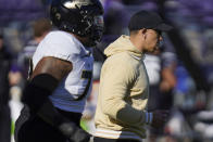Purdue head coach Ryan Walters takes the field with his team before an NCAA college football game against Northwestern, Saturday, Nov. 18, 2023, in Evanston, Ill. (AP Photo/Erin Hooley)