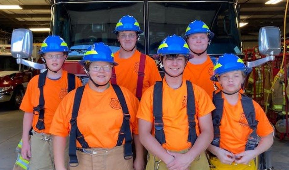 Younger Explorers sport new blue helmets and orange T-shirts, designed for easy identification.